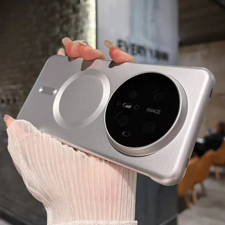 Silver phone case with circular camera module.