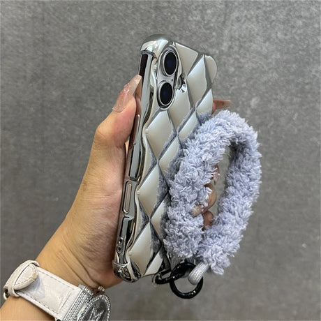 Silver quilted phone case with fluffy strap.