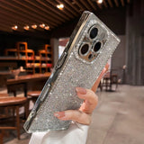 Glittering silver smartphone case with diamond-studded camera and side bezels.