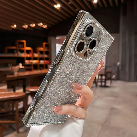 Glittering silver smartphone case with diamond-studded camera and side bezels.