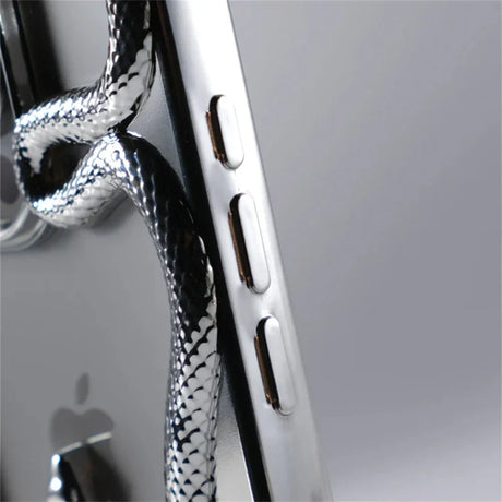 Silver smartphone with snake-patterned cord.