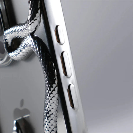 Silver smartphone with snake-patterned cord.