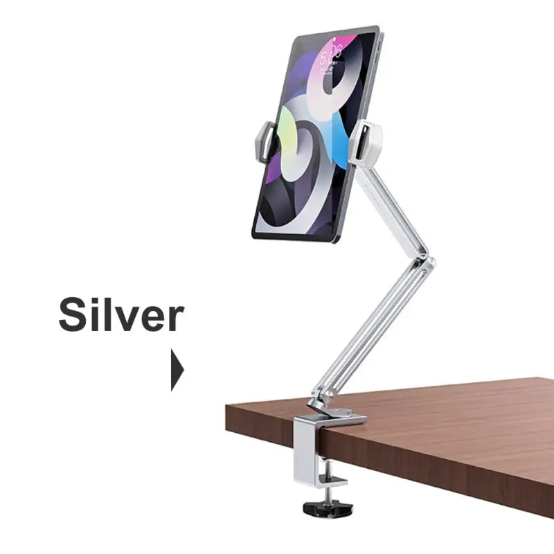 the silver and silver stand is attached to a wooden desk