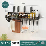 a kitchen wall mounted rack with knives and uts