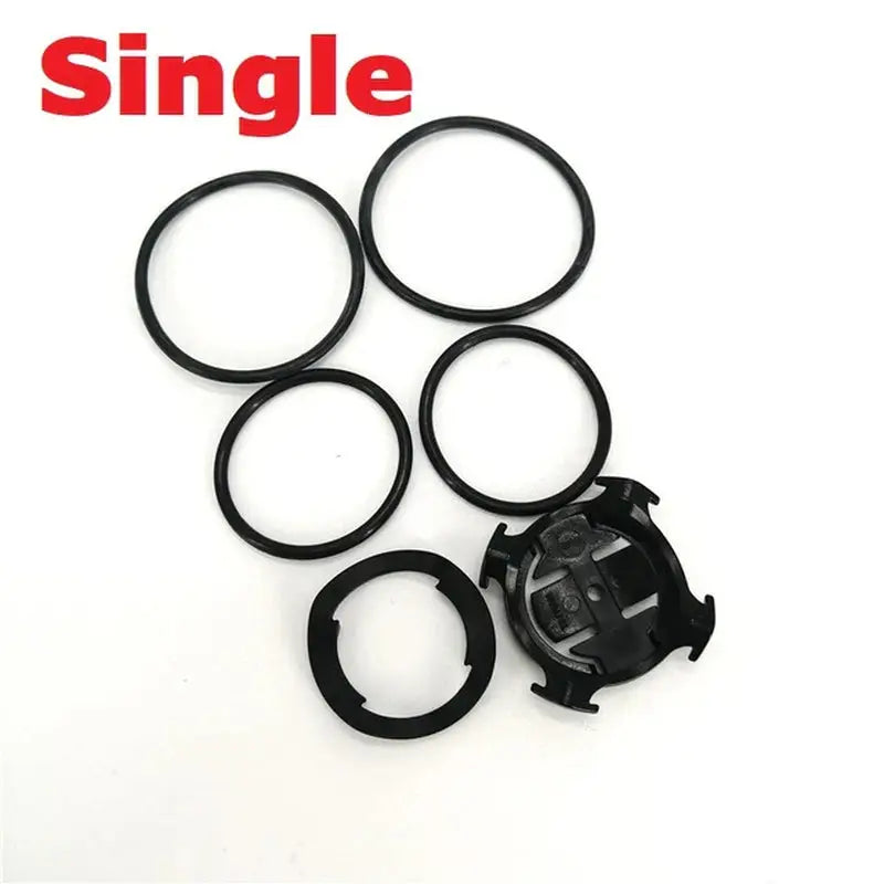a set of four black rubber o - rings