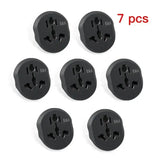six black plugs with the names of the plugs on them