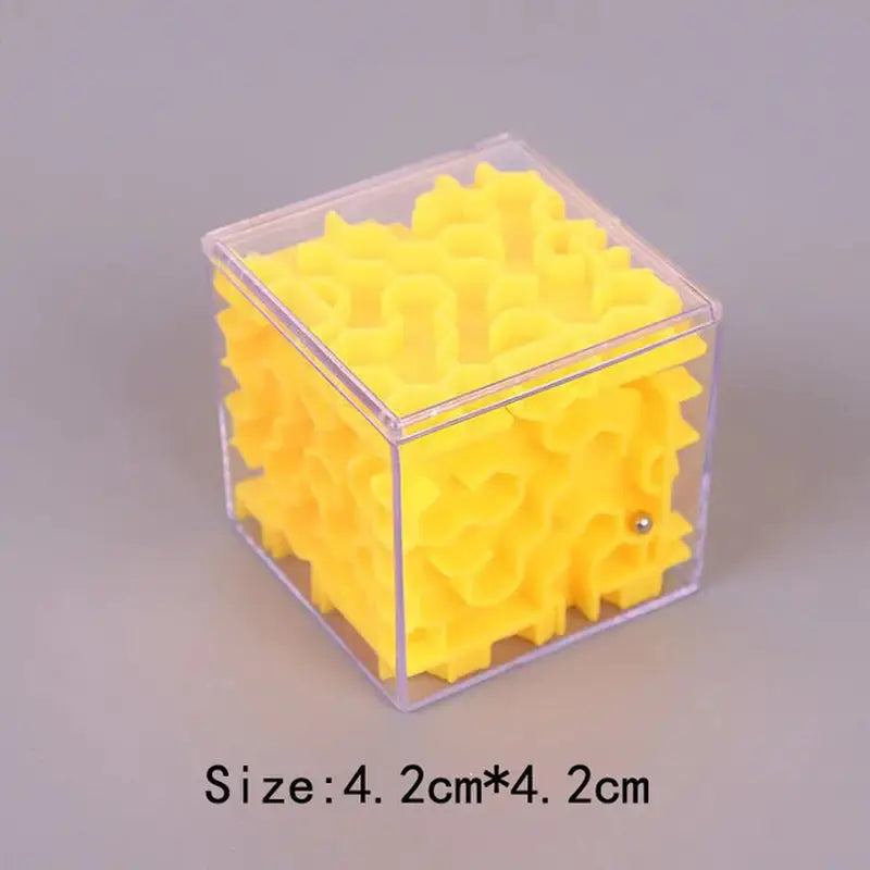 a yellow plastic cube with a small plastic cube inside