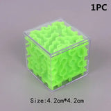 a small plastic cube with a green glow
