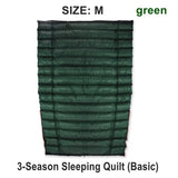 a green sleeping bag with the text’s e m ’