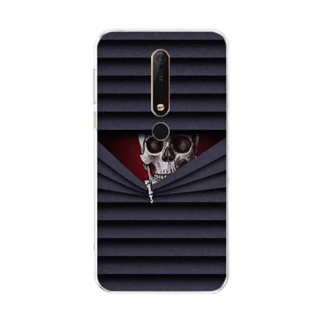 a close up of a cell phone with a skull on it