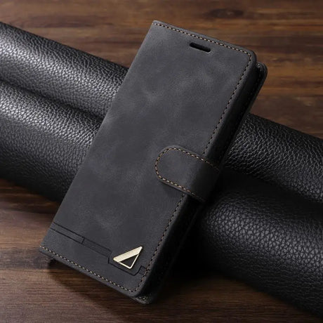 Sleek black leather wallet-style phone case with a metallic accent.