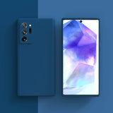 Sleek blue smartphone with a triple camera setup and vibrant display showing geometric shapes.