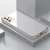 Sleek white smartphone with a gold-trimmed edge and multiple camera lenses.