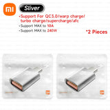 two silver batteries are in a plastic bag with a white background