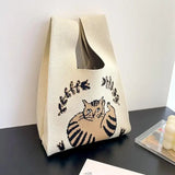 a small bag with a cat on it