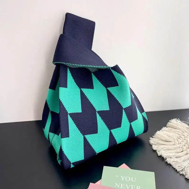 a small bag with a green and black pattern