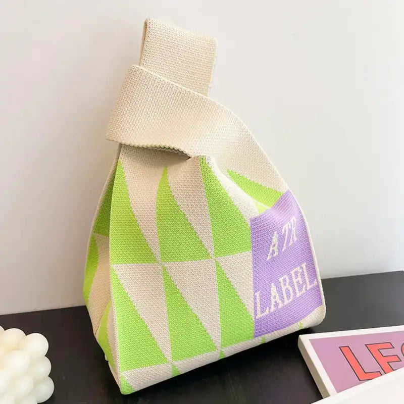 a small bag with a purple and green design