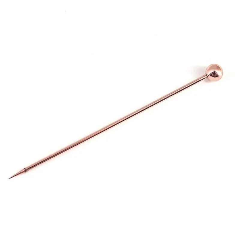 a copper colored metal pin with a long pointed tip