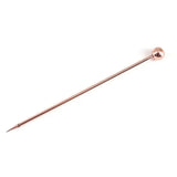 a copper colored metal pin with a long pointed tip
