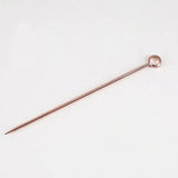 a small metal pin with a long handle