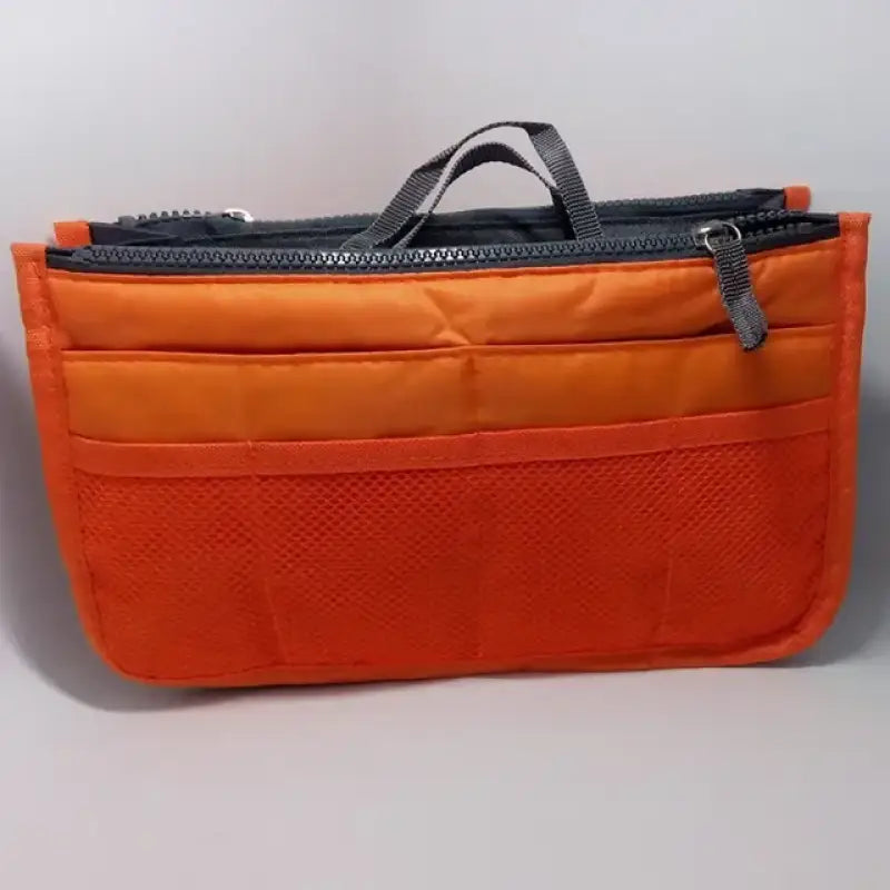 a small orange bag with a zipper