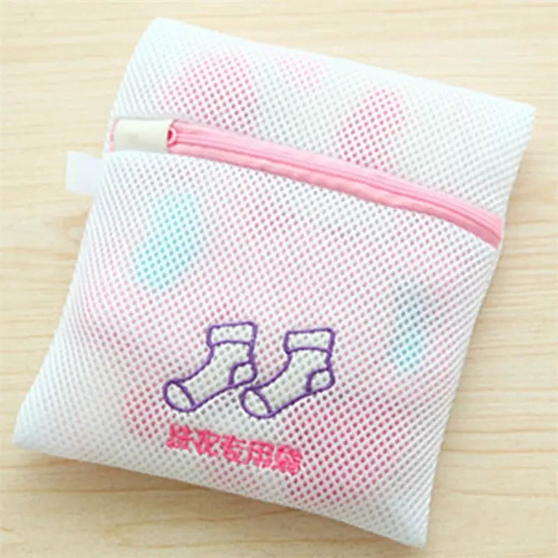 a small bag with a small pink and blue heart on it