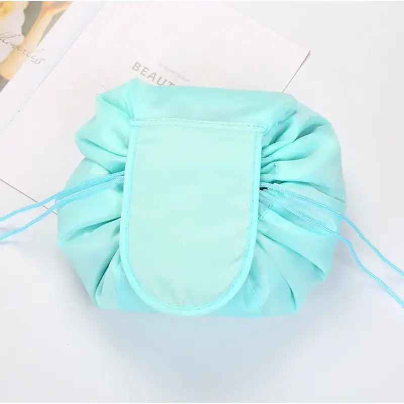 a small pouch bag with a blue ribbon