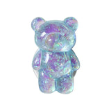 a purple and blue bear with a white background