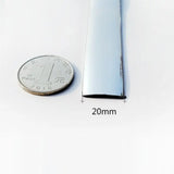 a close up of a quarter of a coin next to a piece of metal