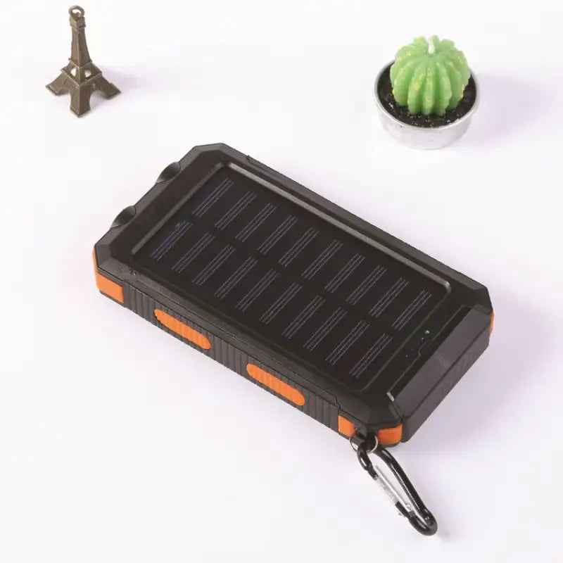 a small solar powered device with a small cactus
