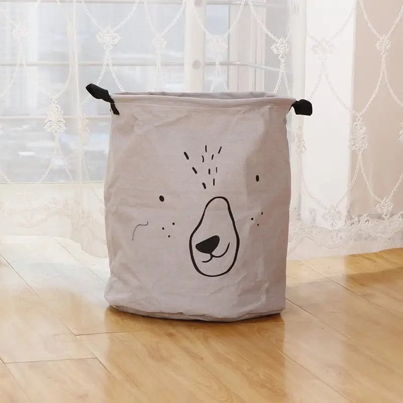 a white laundry bag with a black bear face on it