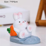 a small white rabbit figuri with carrots