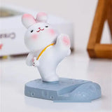 a small white rabbit fig with a yellow ribbon