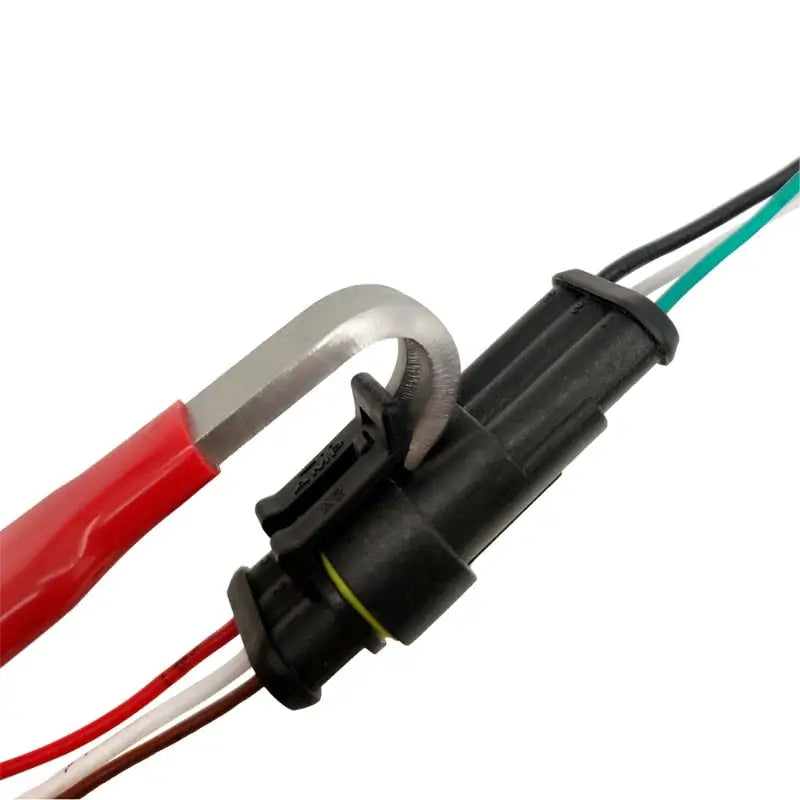 a close up of a wire with a red and green wire