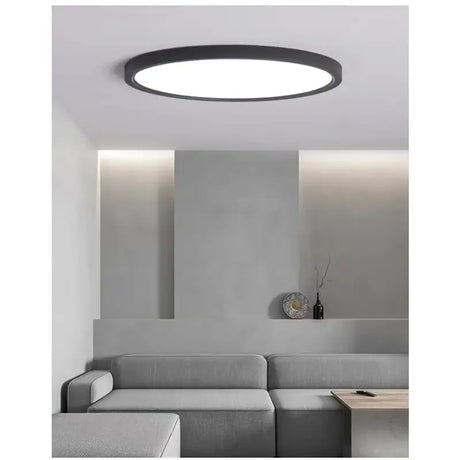 a round light fixture in a living room