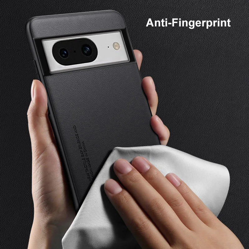 Smartphone with a black case being wiped by a white cloth, highlighting its anti-fingerprint feature.