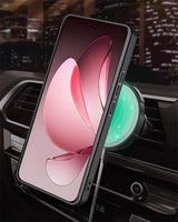 A smartphone in a black case, charging wirelessly in a car.