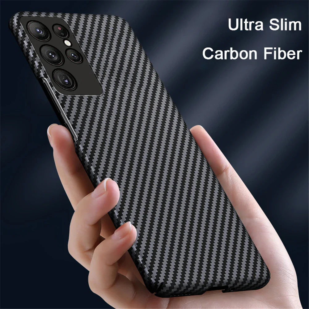 A smartphone in a black and grey carbon fiber case.