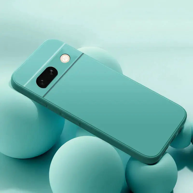 a smartphone with a blue case on top of it