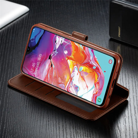 Smartphone in a brown leather wallet-style case displaying a colorful abstract wallpaper on its screen.