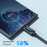 a smartphone with a charging cable attached to it