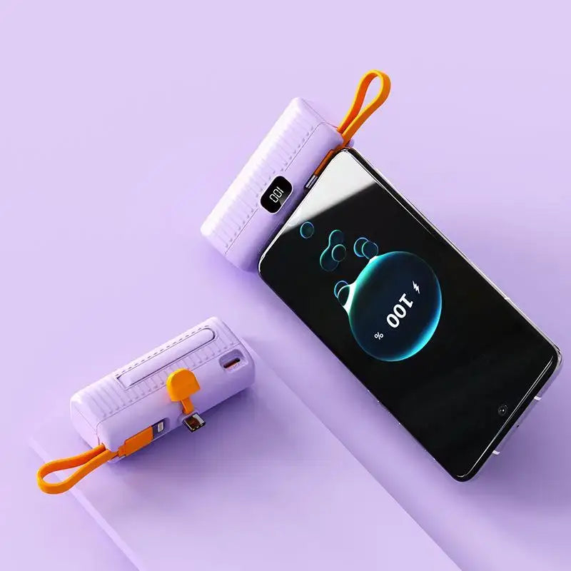 a smartphone with a charging cable attached to it