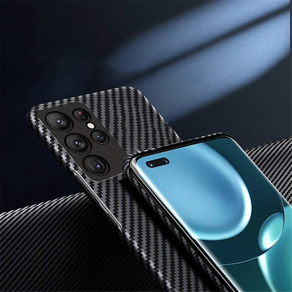 A smartphone with a carbon fiber textured protective case.
