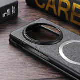 Smartphone case with a circular camera cutout and textured fabric covering.