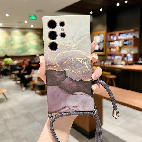 Smartphone case with a marbled design and multiple camera cutouts.