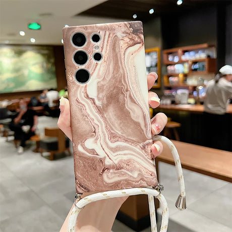 Smartphone case with a marbled pink and white design and multiple camera cutouts.