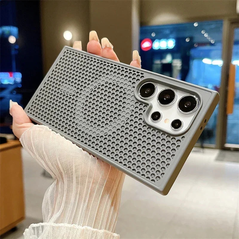 Smartphone case with a perforated metal design and camera cutouts.