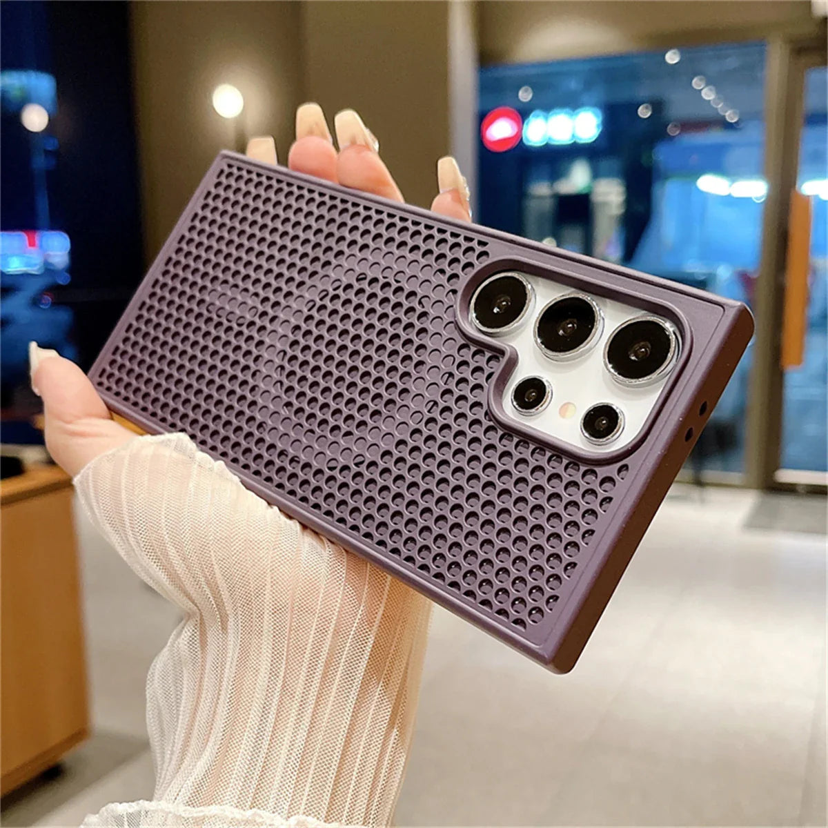 Smartphone case with a textured honeycomb pattern and camera cutouts.