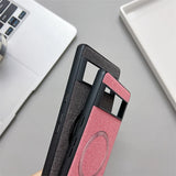 Smartphone case with a textured pink and black design featuring a circular element.