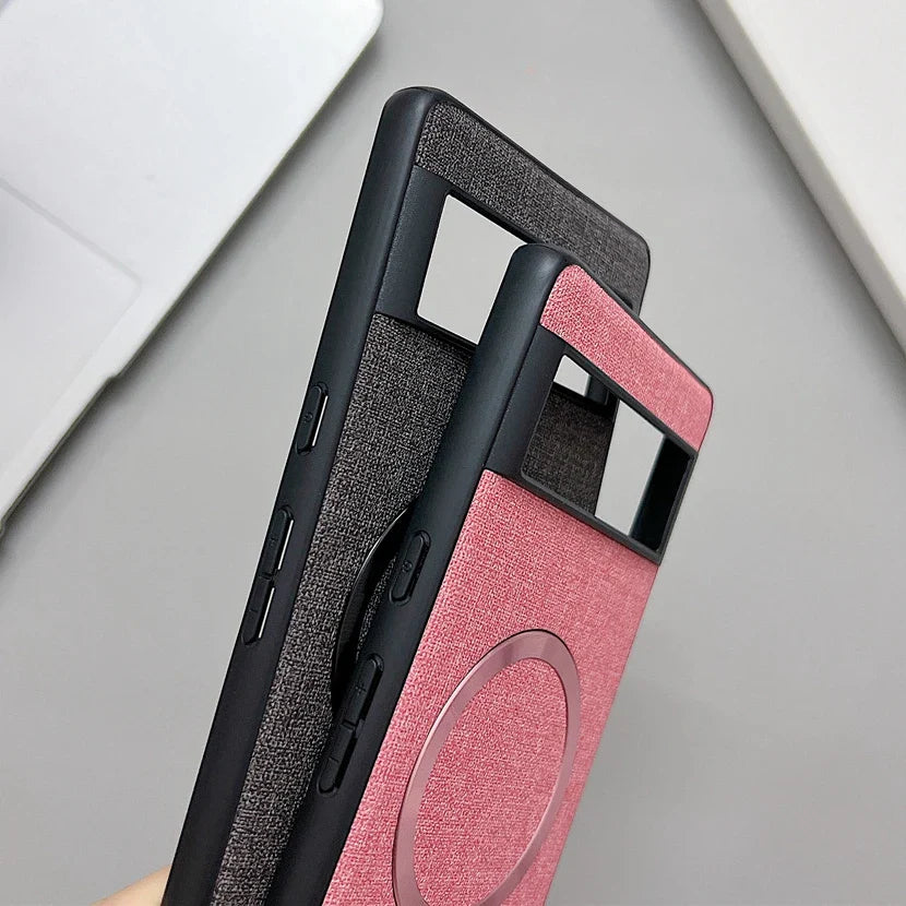 Smartphone case with a two-tone design in black and pink, featuring a textured fabric-like finish.